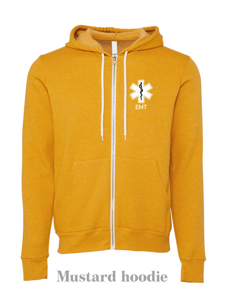 EMS Star: "EMT" on a mustard colour zip up hoodie