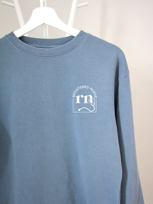 Cred Arch: RN on Slate Blue sweatshirt