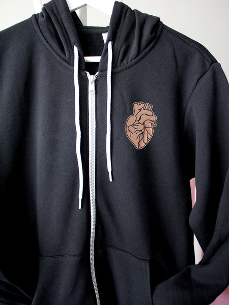 HEART-ology with a rose gold heart on a black hoodie