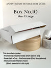 Promotional image of an 'Anniversary Bundle Box 2026' with a large white box on a light background.