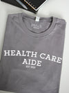 Collegiate: "Health Care Aide est. 2021" on Storm long sleeve