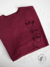 Frontliners: Maroon sweatshirt with "RN"