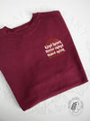Kind Fierce Brave - Maroon sweatshirt with copper arches