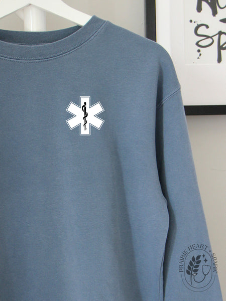 EMS Star: Black colour Rod of Asclepius on a Slate Blue sweatshirt