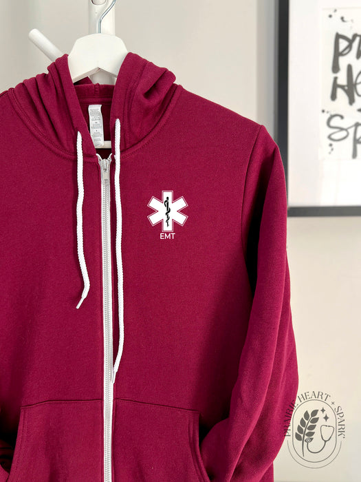 EMS Star: Black colour Rod of Asclepius with EMT on a Maroon zip up hoodie