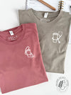 Essentials: Cup + ID Badge with "HUC" on Mauve long sleeve; Cup + Stethoscope on Stone long sleeve