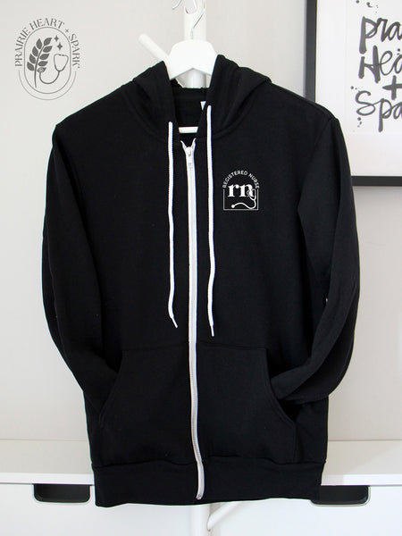 Cred Arch: "RN" on a Black zip up hoodie