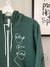 Frontliners (White "RN") on a Heather Forest zip up hoodie