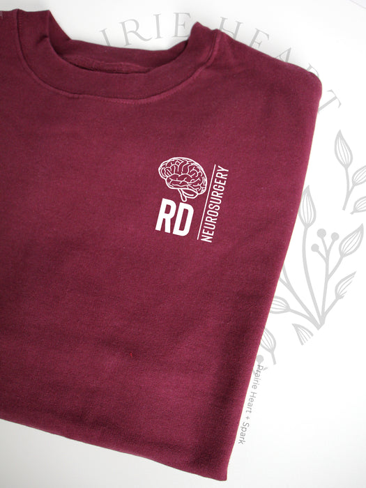 HSC Neurosurgery Block RD design on a Maroon sweatshirt