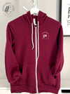 Cred Arch: "PT" on a Maroon zip up hoodie