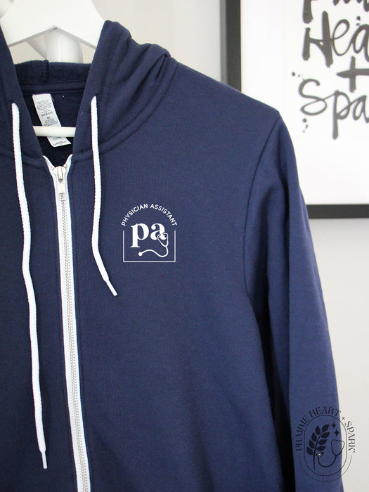 Cred Arch: "PA" on a Navy zip up hoodie