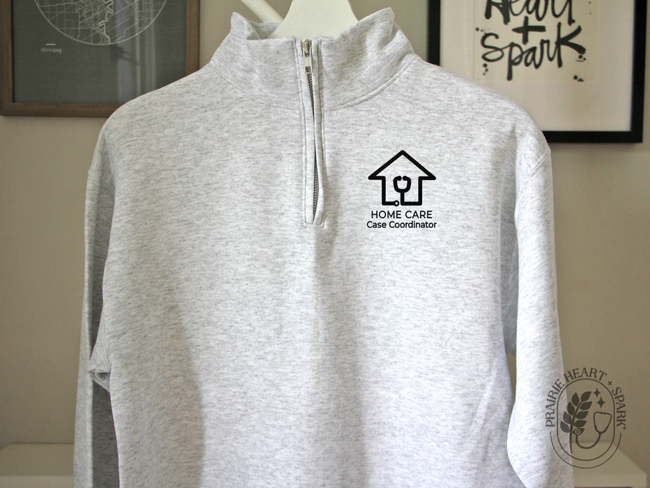 Ash Grey quarter-zip sweatshirt with Home Care case coodinator logo in black design
