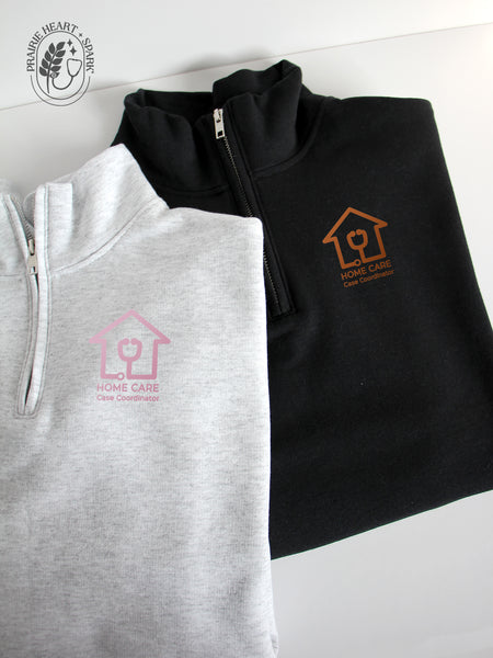 Ash Grey and black quarter-zip sweatshirts with a Home Care Case Coordinator logo in mock up rose gold & copper colour