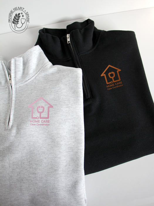 Ash Grey and black quarter-zip sweatshirts with a Home Care Case Coordinator logo in mock up rose gold & copper colour